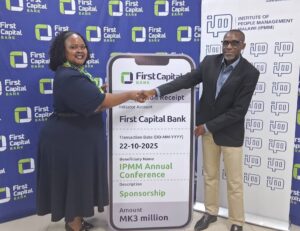 bwanali (left) giving a dummy cheque to nkhoma (002)