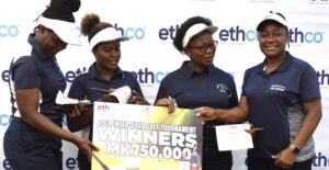 chakaniza (right) presenting a cheque to nchalo team the winners of inter club tournament last year