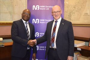 Scottish First Minister hails NBM Development Bank model katsala (left) shaking hands with swinney (002)