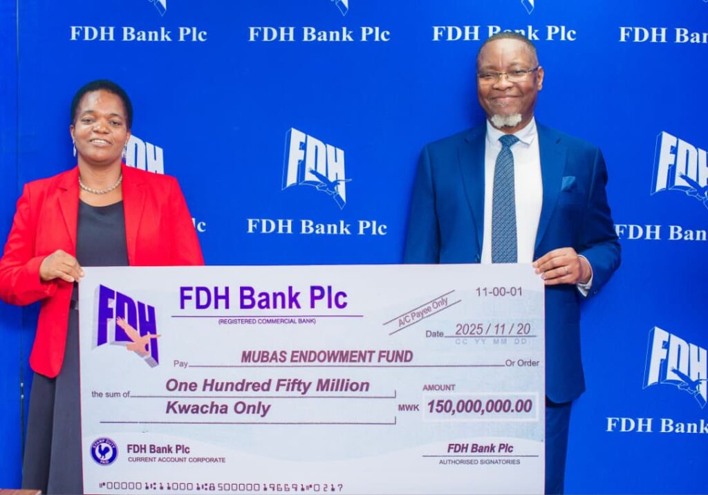 chitera (left) and mkulichi display the dummy cheque