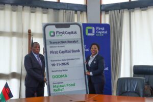 FCB plc gives K210 million for food relief jazza handing over the cheque to mwanamveka (002)