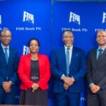 mubas and fdh bank officials pose for a photograph after the event