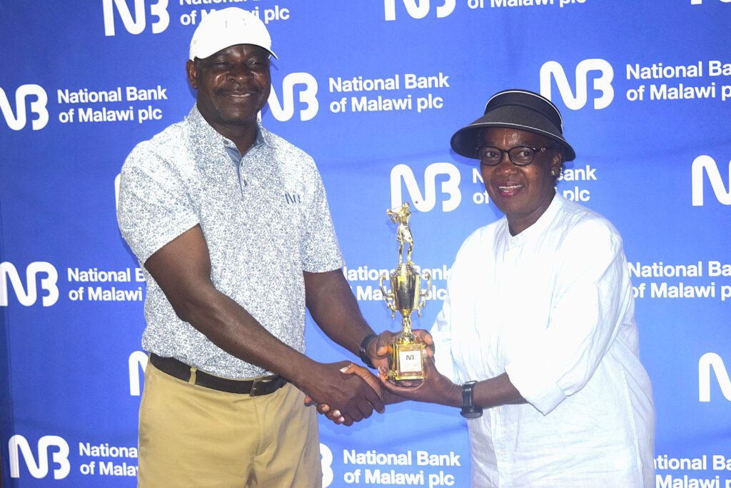 mabulekesi (left) handing over the trophy to chinkhandwe (002)