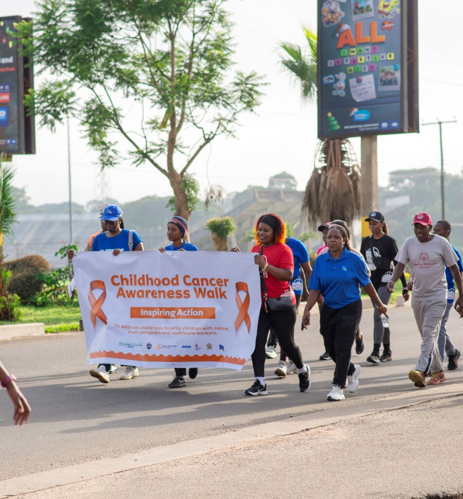 Walkers’ fun walk targets to raise K50 million for QECH Children’s Cancer Ward part of the walkers carrying a banner
