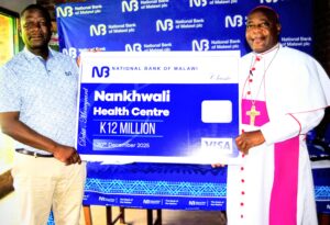 NBM plc renovates Nankhwali Health Centre in Mangochi jiya (left) handing over the k12 million cheque to rt. rev sitima (1) (002)