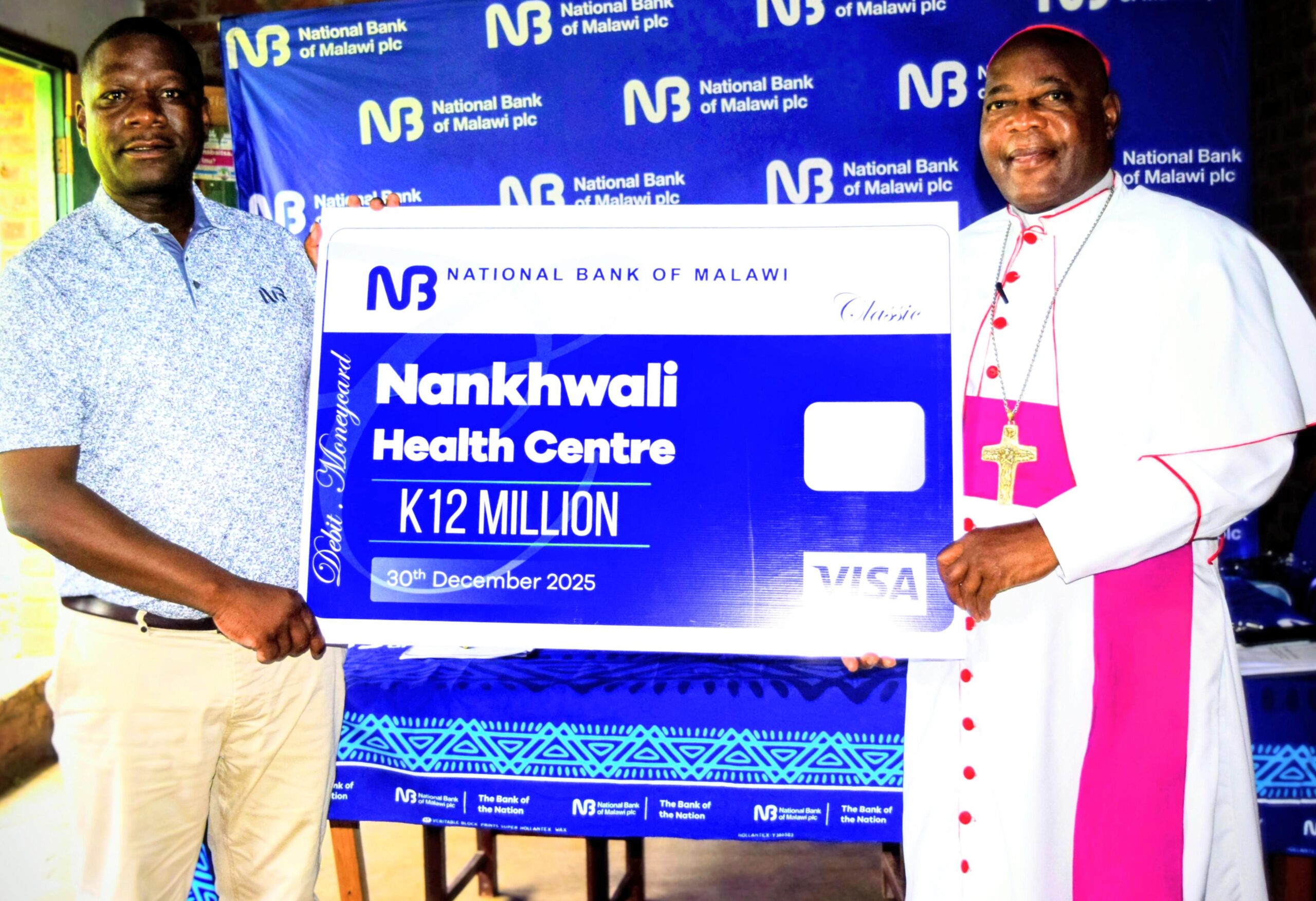 jiya (left) handing over the k12 million cheque to rt. rev sitima (1) (002)