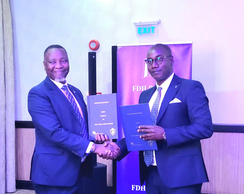 FDH Bank plc takes over Super League with K5 billion sponsorship mkulichi(left) shakes hands with mittawa after signing an mou (002)
