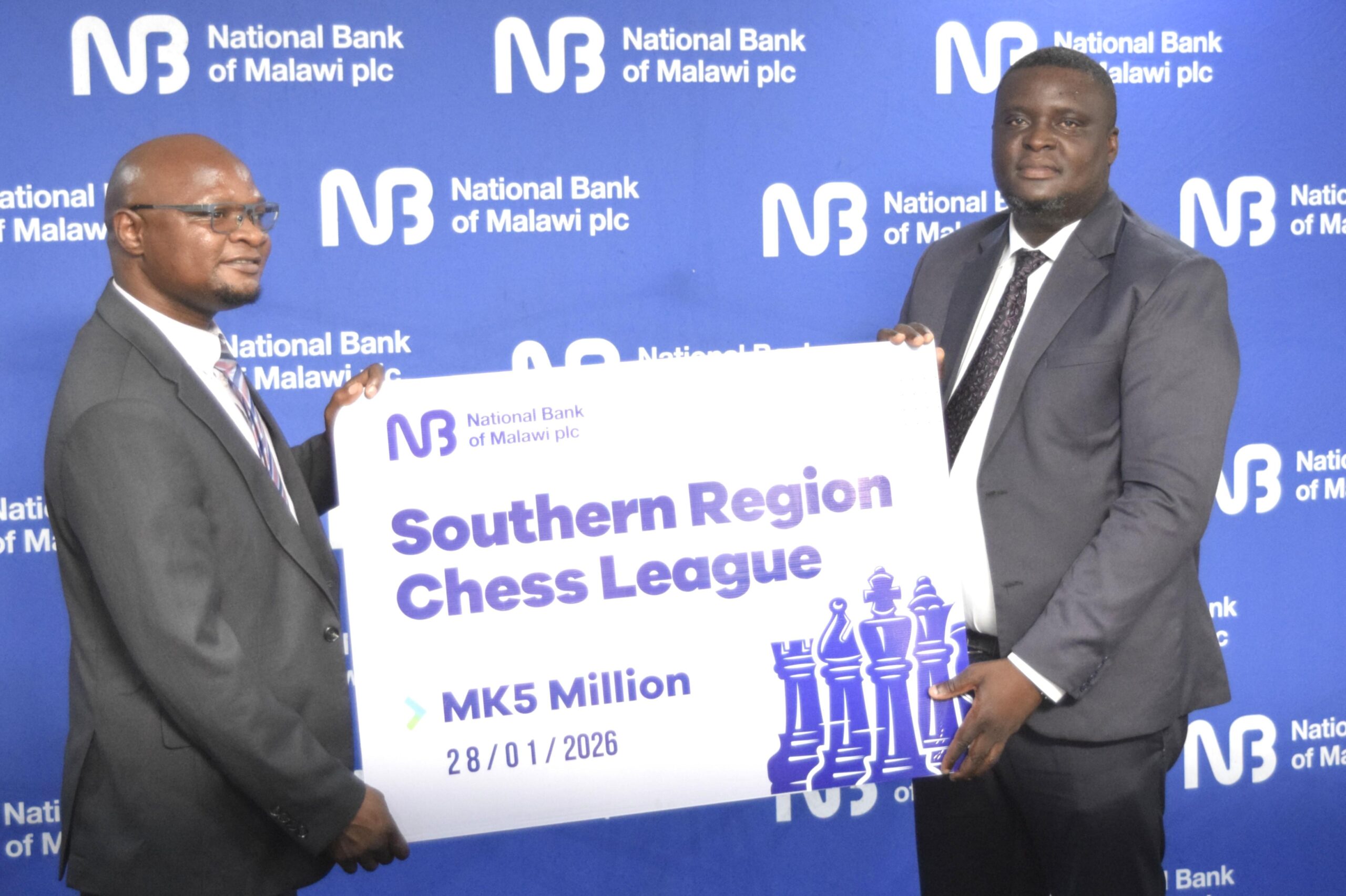 NBM plc boosts Veterans chess tourney with K5 million support ngalande (right) handing over symbolic cheque to nyamilandu (002)
