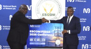 Chatsala Right handing over the cheque to Ndisale 002 scaled