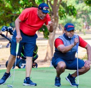 Coombes (left) and the late Chilima during one of their golf matches