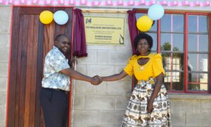 PIL donates K150 million ICT lab and library to Katole CDSS Kerring(Left) handing over laboratory and library to Mjima (002)