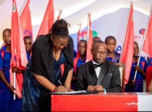 NBS Bank commits K5 billion to BEAM sanitation drive NBS CEO Simwaka (left) signing and MoU with BEAM Trust while NBS Bank Board Chairperson Vizenge Kumwenda looks on (002)