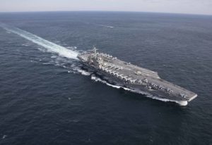 Iran Claims Missile Strike on US Aircraft Carrier, Warns of Further Action FB_IMG_1774497048366