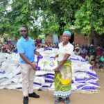 Nkhomaanthu Left Handing Over Maize Flour To Beneficiary 002 150x150