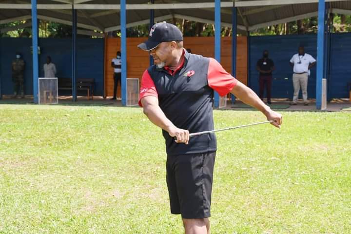 the late chilima warming up for the game of golf