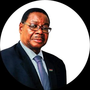 Kalindo calls DPP to do sole - searching on electricity blackouts 8 Peter Mutharika wearing a suit and glasses