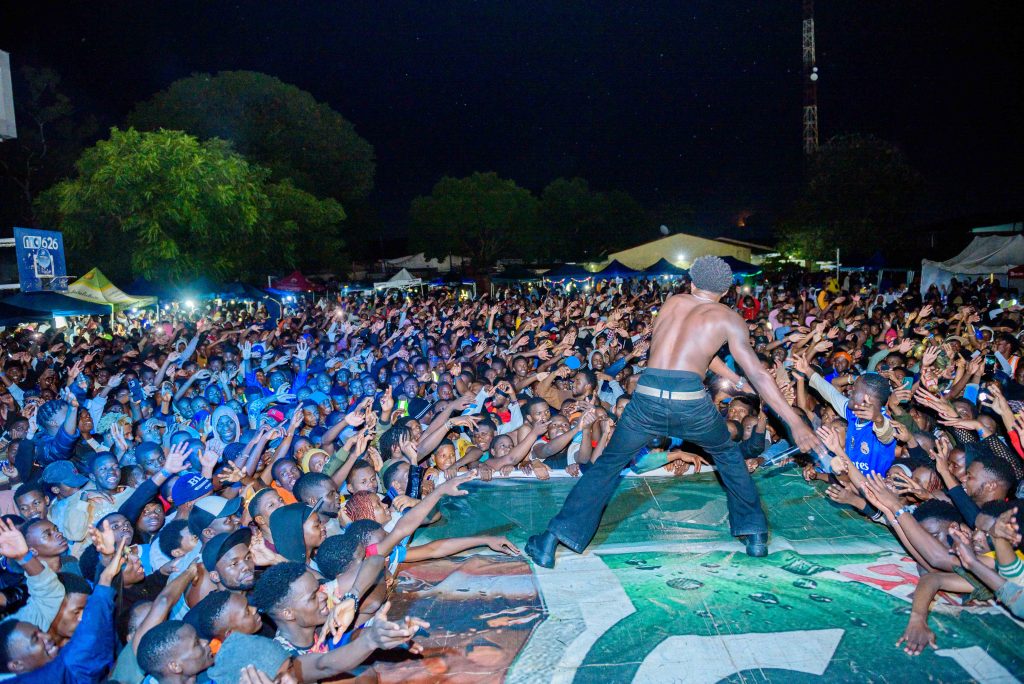 Joe Ikon on stage in a left right wave with the audience