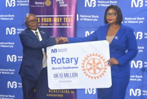 NBM plc gives K10 million to Rotary Club of Blantyre for international conference Mphepo-Hiwa(Right) handing over the cheque to Nkosi (002)