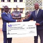 Mkhomaanthu left handing over the cheque to Mkandawire 002