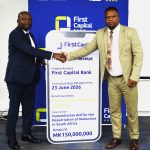 Chirwa right handing over a cheque to Moleni 002