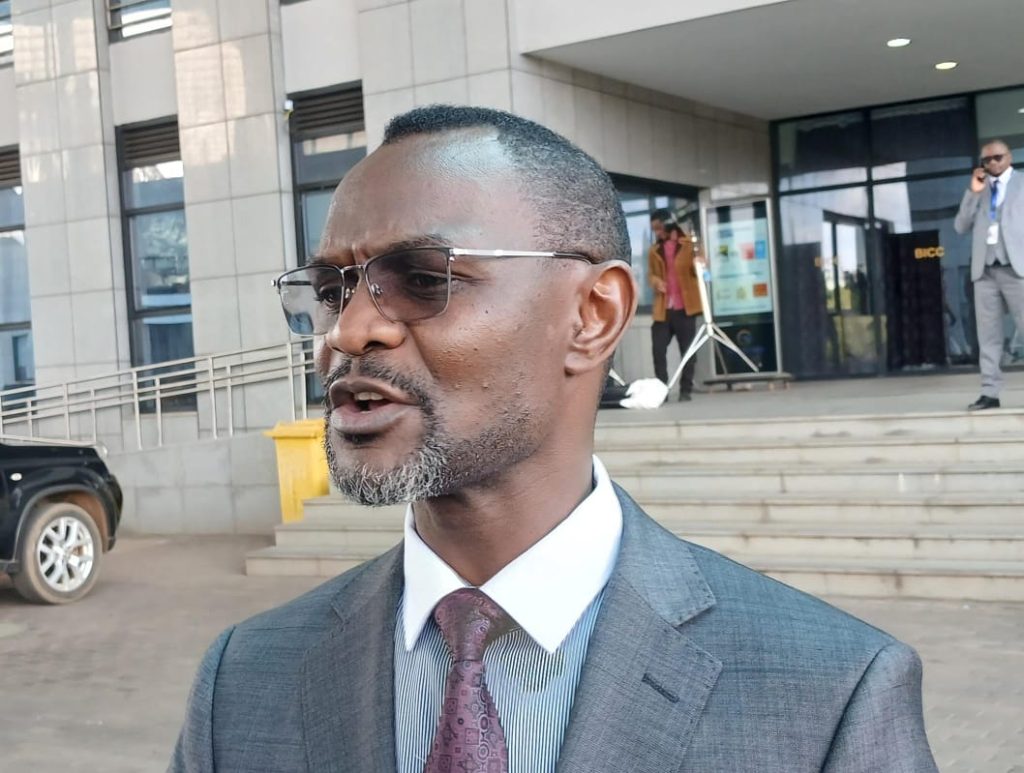 Ben Phiri, Minister of Local Government and Urban Development, speaking outside the BICC