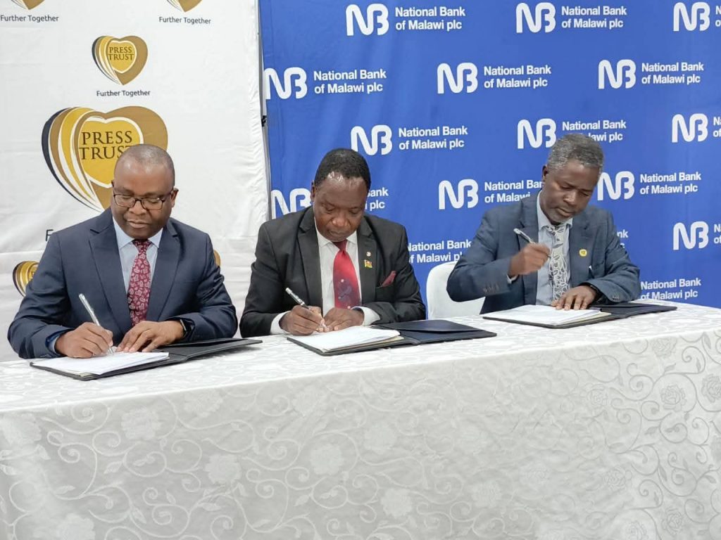 NBM plc, Press Trust commit K1.2 billion for girl’s hostel project 2 NBM, Press Trust and government officials signing the K1.2 billion agreement for Njerenje CDSS hostel and staff housing