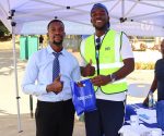 NBM awards over 50 customers in ‘Waku Wa WAFCON’ POS promo 19 Caleb Mtima from NBM Digital Financial Services department Right handingover the prize to Witness 002