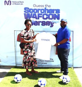 Chapeyama (Right) presents a jersey to Chulu