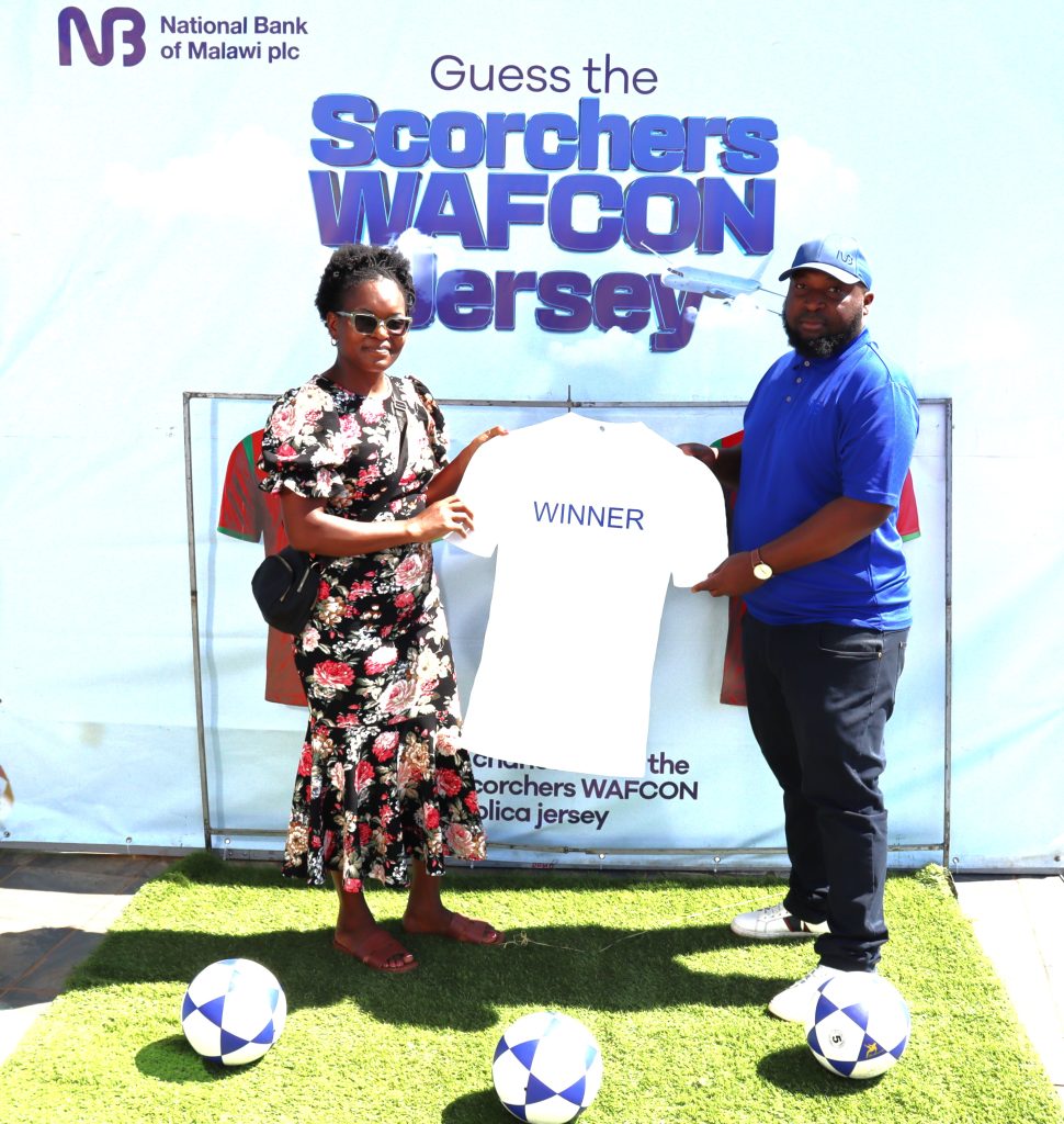 Chapeyama Right presents a jersey to Chulu