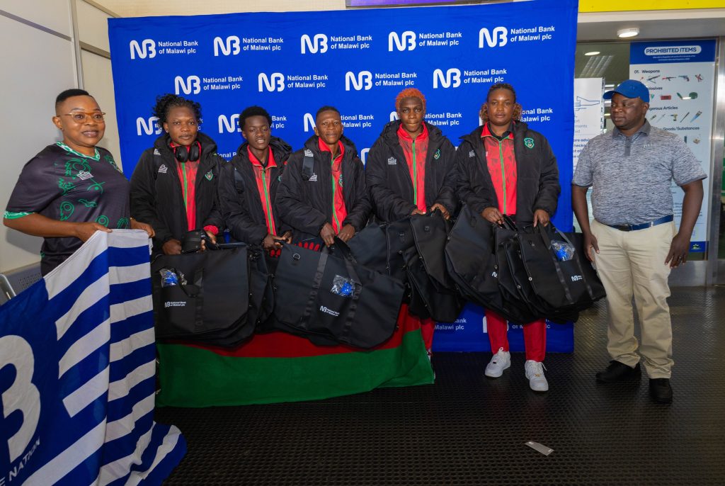 NBM plc backs Scorchers as they depart for WAFCON 3 Chimwemwe Chijere NBM plc Business Development Manager Right posing for a picture with the Womens Team squad at KIA alongside an official from the team 002
