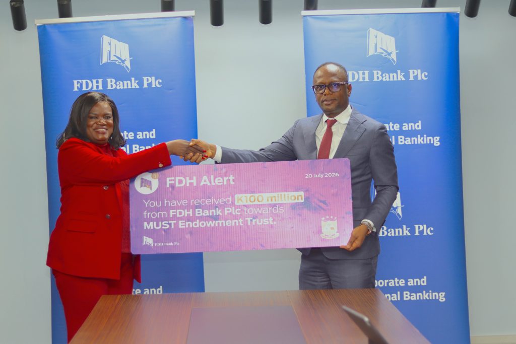 FDH Bank pumps K100 million into MUST Endowment fund initiative 2 FDH Bank Deputy Managing Director George Chitera Right handing over a dummy cheque to Malata 002