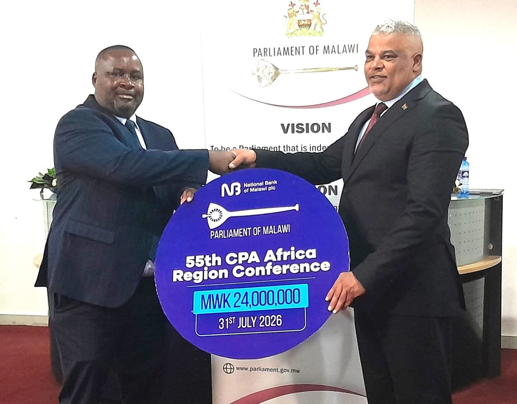 NBM plc boosts CPA Africa Region Conference with K24 million sponsorship 6 Masi left handing over the cheque to Suleman 002