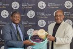 SKC Foundation donates K10 million items for repatriated Women and Children 20 Mkwambisi right making a symbolic presentation of some of the items to Mwafongo