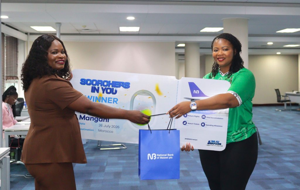 Mphepo-Hiwa-Right-presenting-a-dummy-ticket