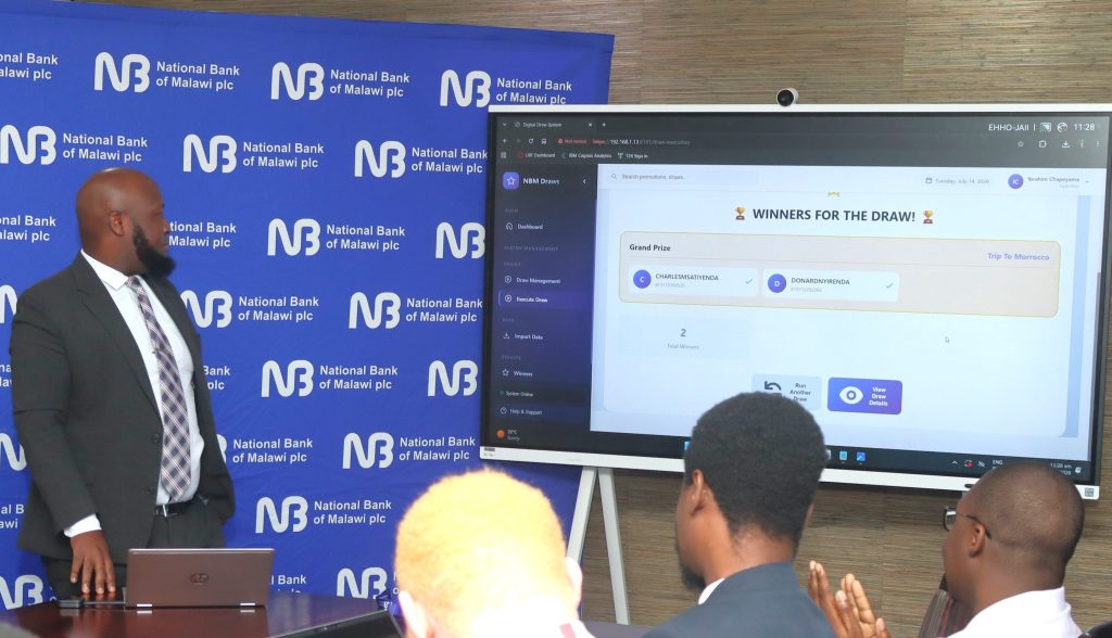 NBM plc unveils 2 ‘Waku WAFCON’ grand prize winners 2 NBM plc Products Development and Strategy Manager Ibrahim Chapeyama conduct the draw 002
