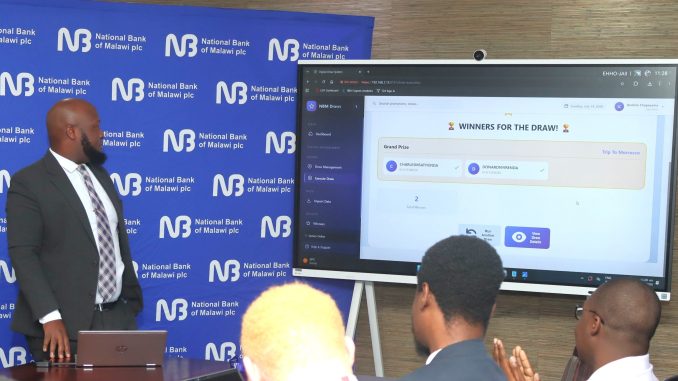 NBM plc Products Development and Strategy Manager Ibrahim Chapeyama conduct the draw (002)