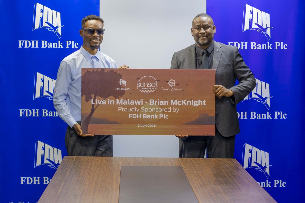 FDH Bank plc backs Brian McKnight concert 2 kaimilaRight handing over the dummy cheque to Lawi 002