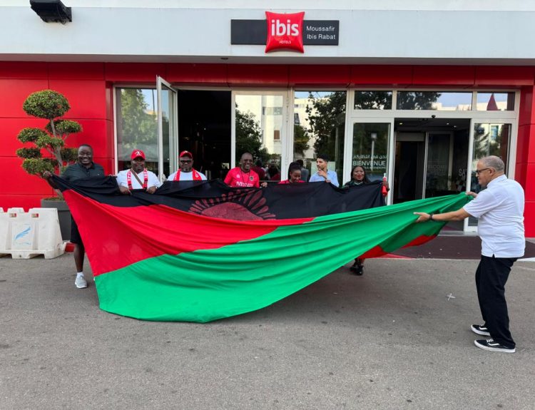 Manager of Ibis Hotel in Rabat Said right join in to help display the Malawi flag with the supporters