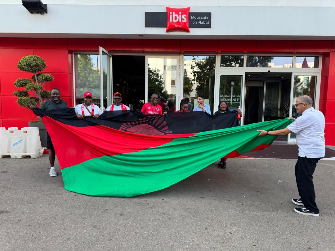 Manager of Ibis Hotel in Rabat Said right join in to help display the Malawi flag with the supporters