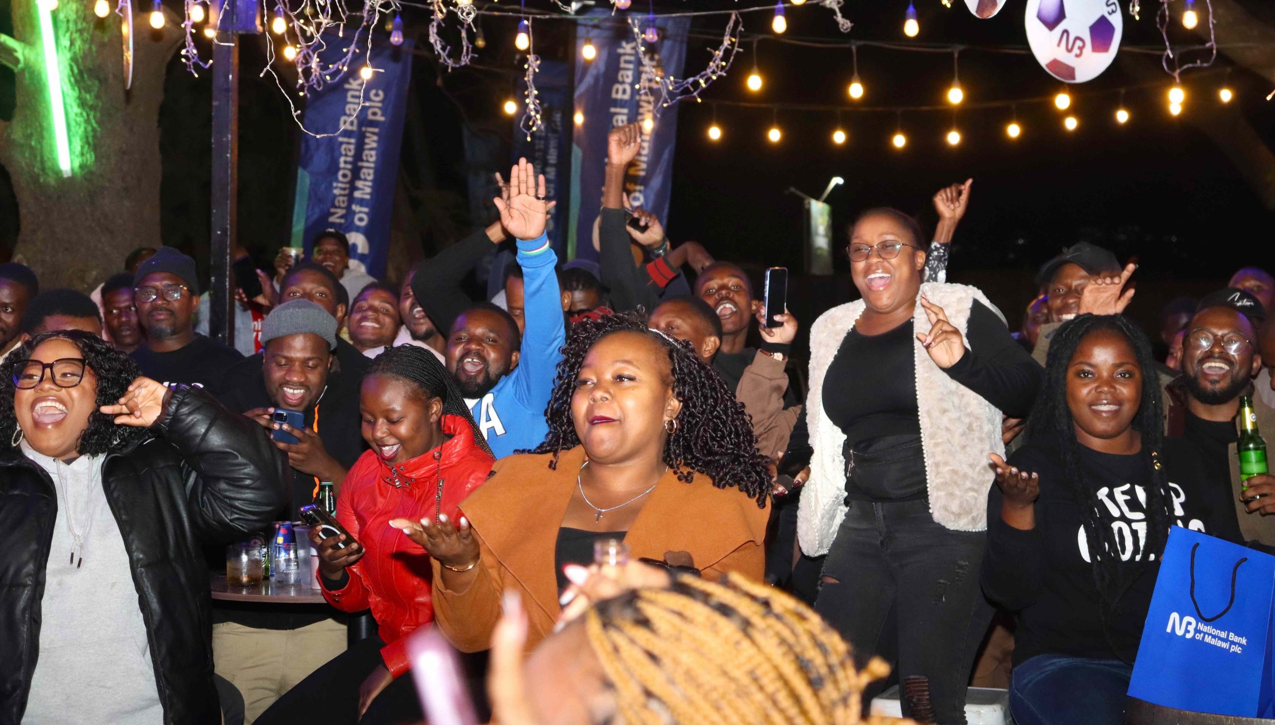 Scorchers supporters celebrate at AJs Lounge in Blantyre 002 scaled