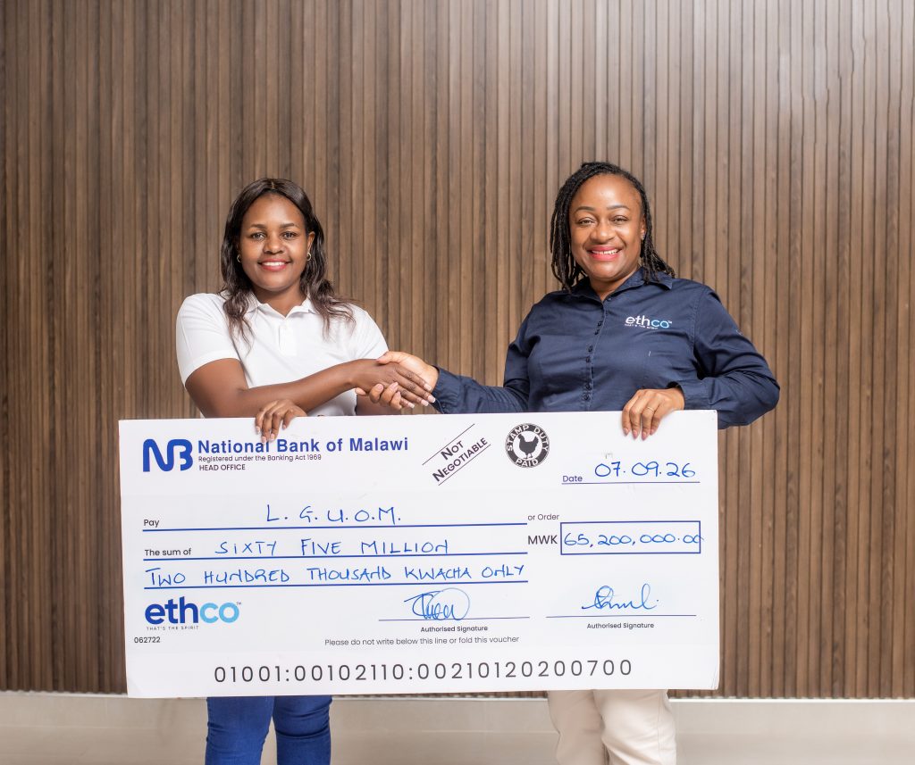 Chakaniza right hands over the dummy cheque to Sibale