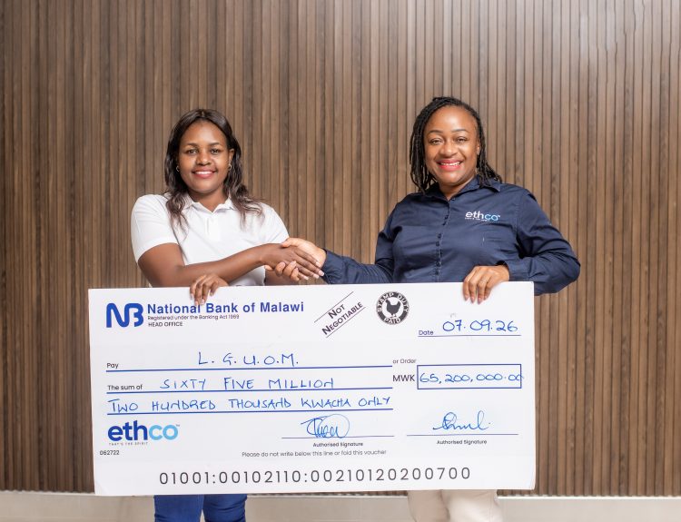 Chakaniza right hands over the dummy cheque to Sibale