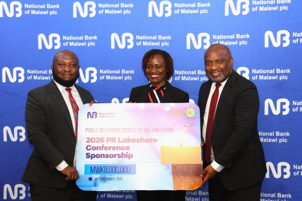 NBM plc supports PRSM lakeshore conference with K8 million 2 Chapeyama Left presenting a dummy cheque to Mhango and PRSM Treasurer General Wadza Otomani 002