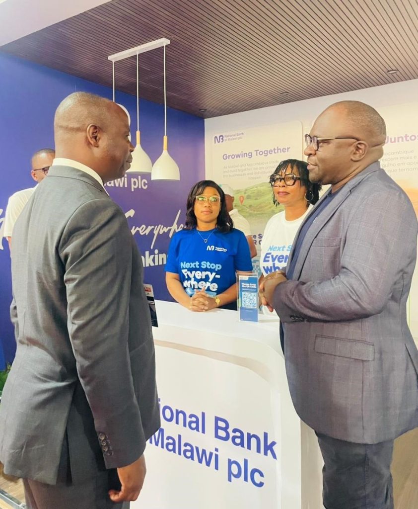 NBM plc strengthens regional footprint at Mozambique trade fair 2 Chapo-Left-engaging-with-NBM-plc-representative-Eric-Bob-Munthali-during-the-Maputo-International-Trade-fairFACIM-