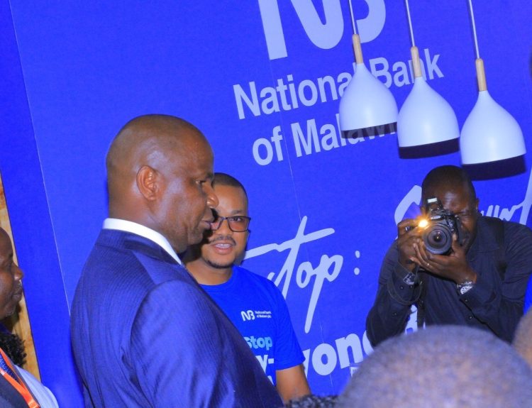 Chapo left engaging with NBM representatives during the Maputo International Trade Fair 002
