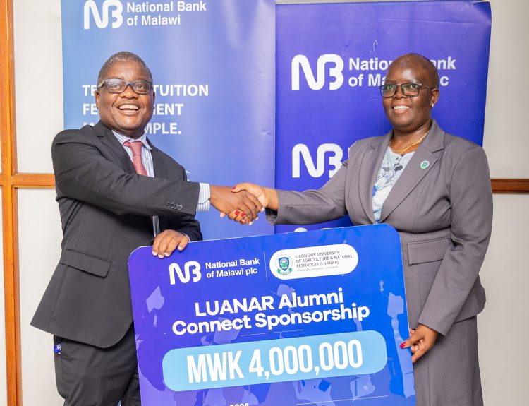 Malenga Left handing over symbolic cheque to Mwangwela 002