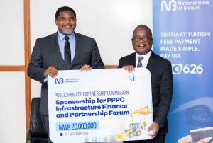 NBM plc supports PPPC Indaba with K20 million | Malawi Freedom Network Malenga right hands over a dummy cheque to Nanthuru 002 1 scaled