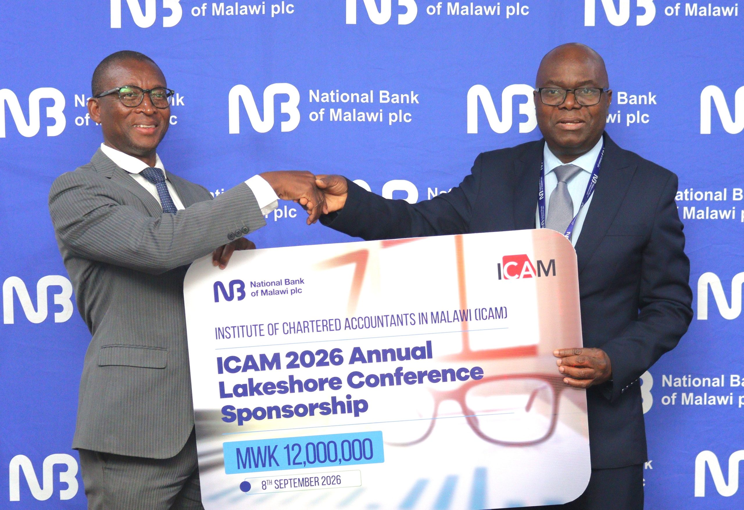 Maneya Right handing over symbolic cheque to Chimpeni 002 scaled