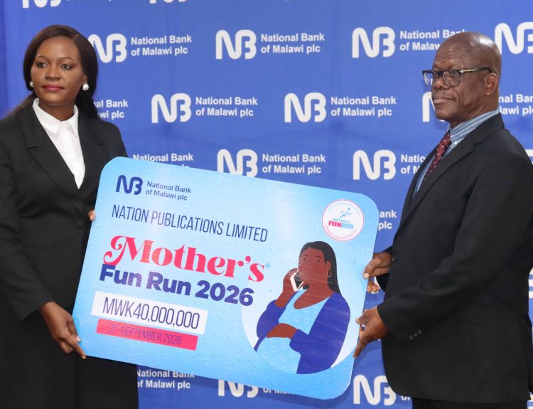 Mwazani left hands over a dummy cheque to Ntonga 002