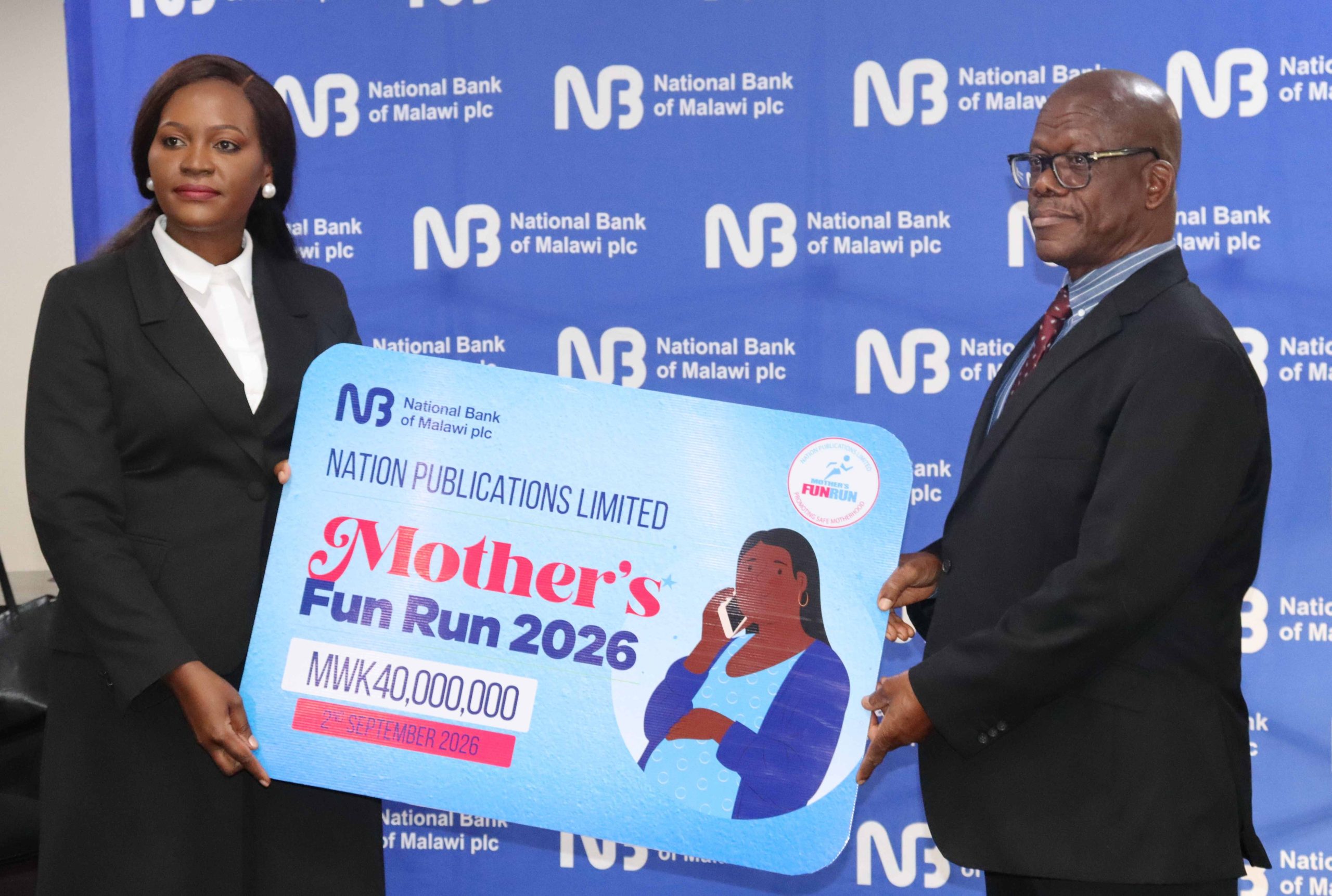 Mwazani left hands over a dummy cheque to Ntonga 002 scaled